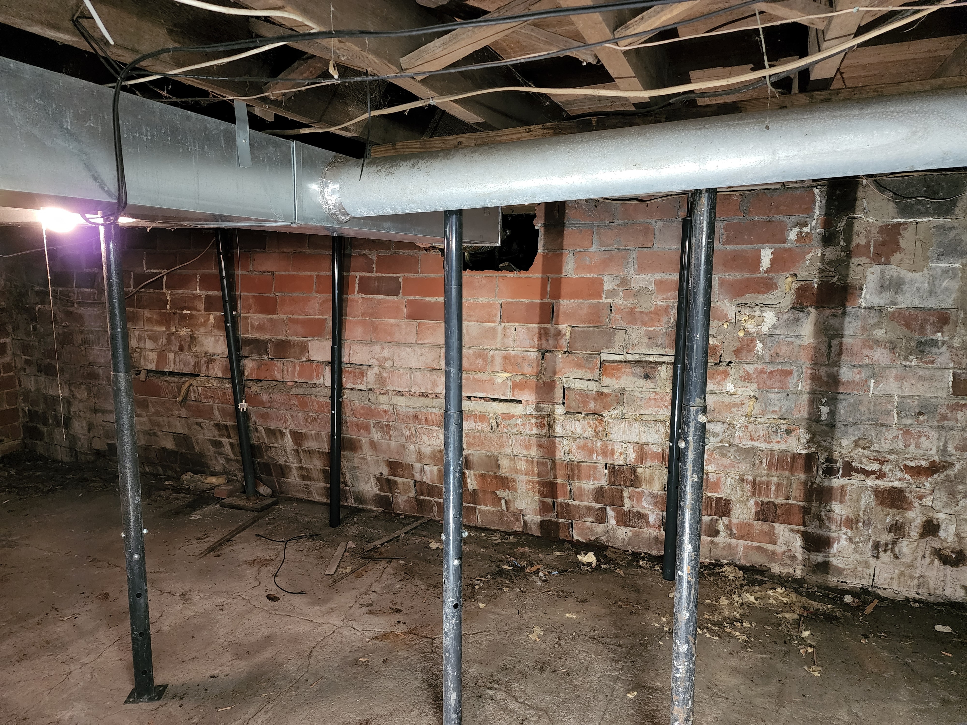 Bowed Foundation Wall Replacement — before
