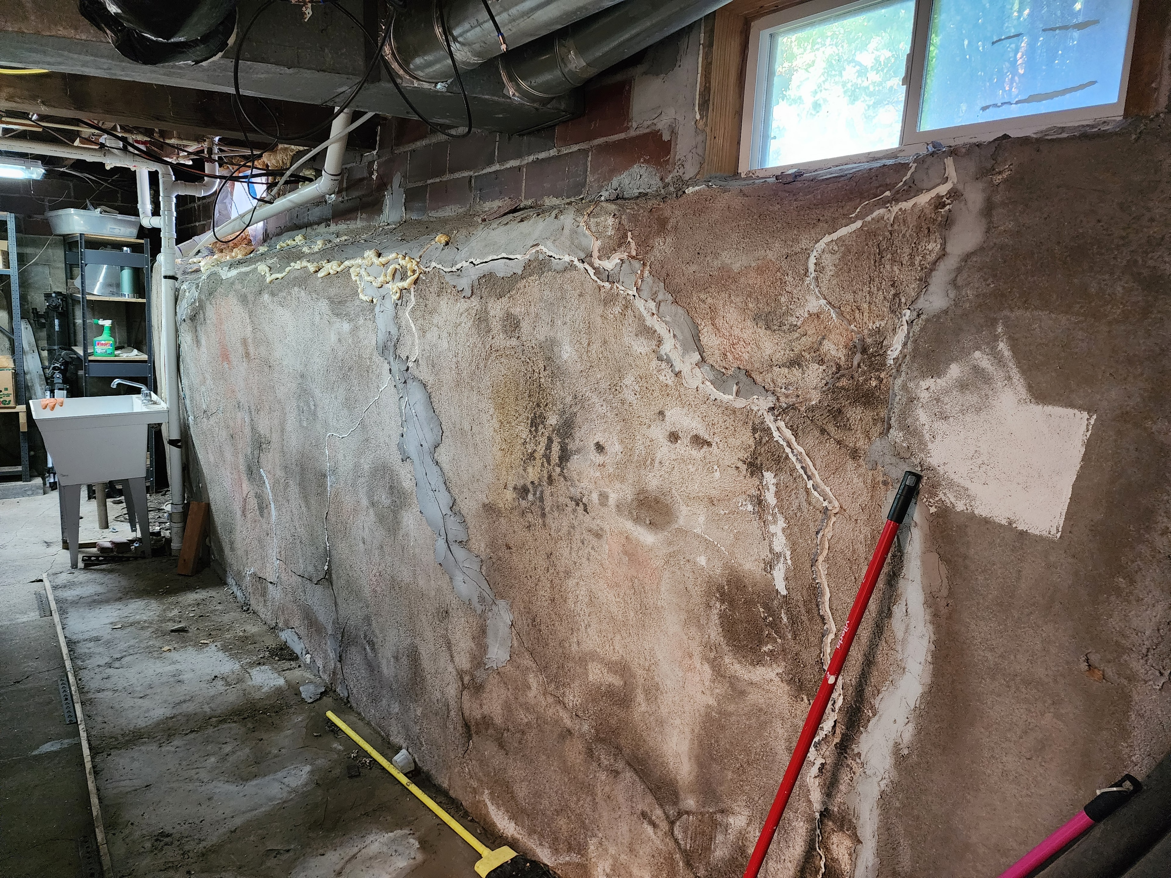 Bowed Foundation Wall Replacement — before